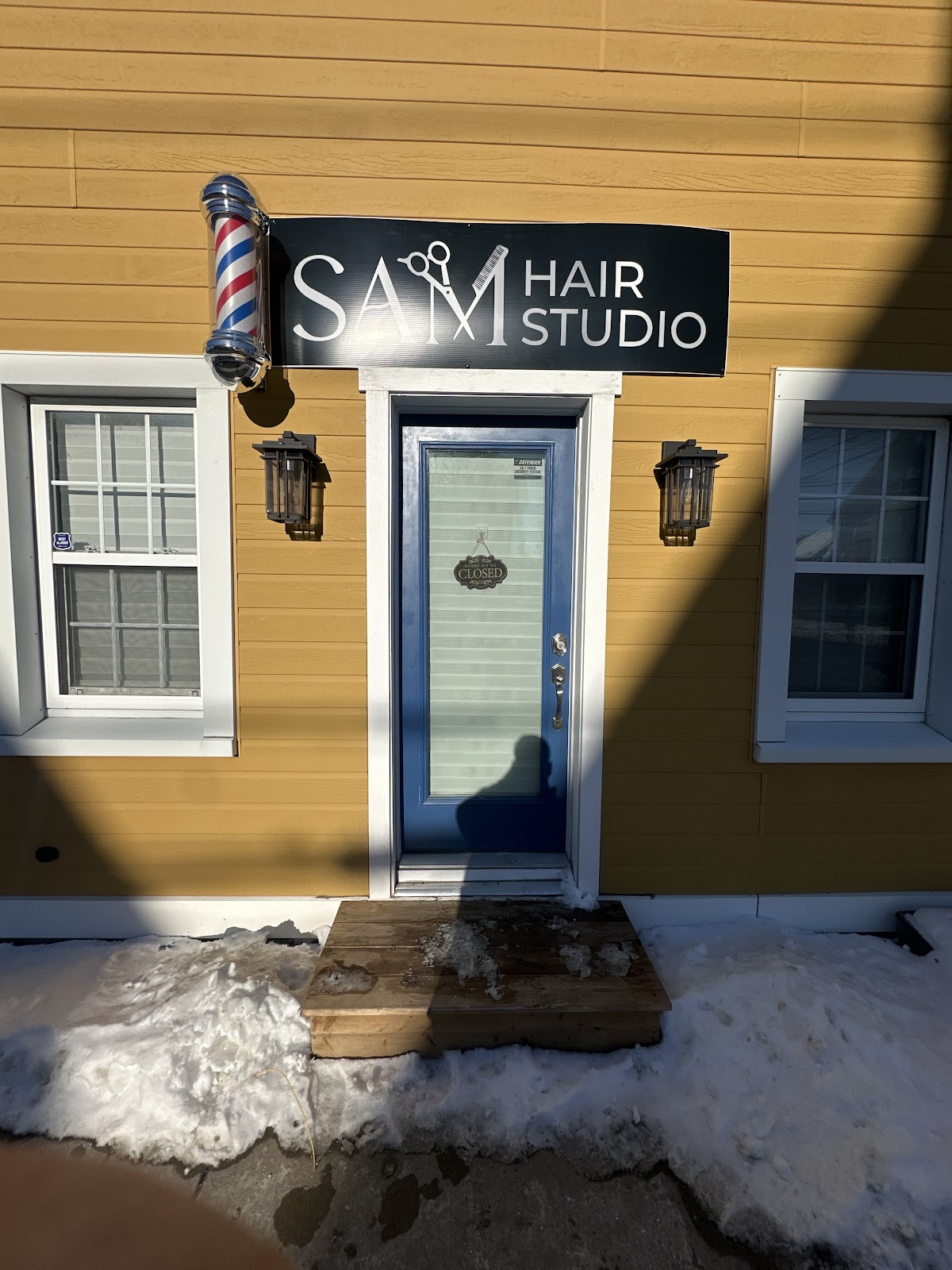Sam Hair Studio entrance with barber pole on Westmorland St